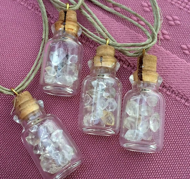 Small gem quality Herkimer diamond in small vials hung on hemp cord.
Art Rains Jewelry